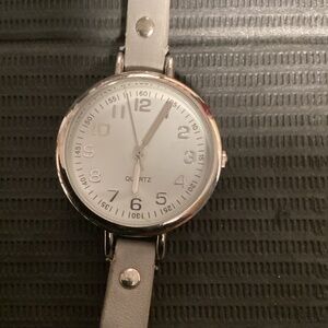 Ladies Quartz Wristwatch with long strange leather-esque band. Running